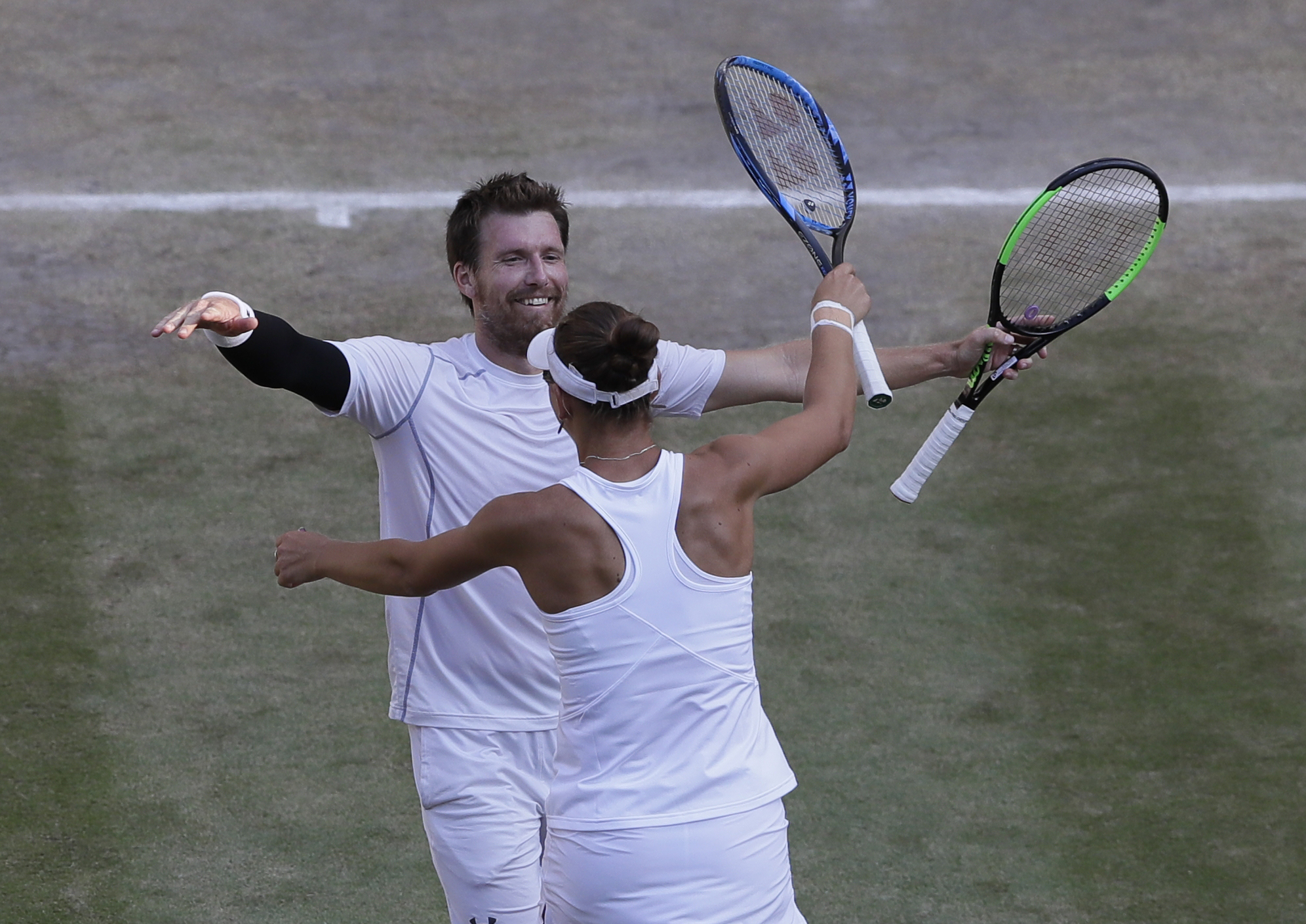 Nicole Melichar of the United States and Austria's Alexander Peya, celebrate winning the mixed doubles final match against Britain's Jamie Murray and Victoria Azarenka of Belarus, at the Wimbledon Tennis Championships, in London,