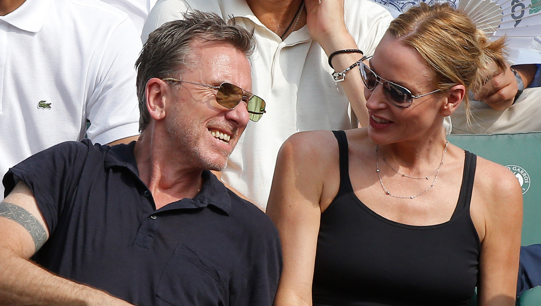 British actor and director Tim Roth and his wife Nikki Butler watch the men's final match of the French Open tennis tournament at the Roland Garros stadium in Paris